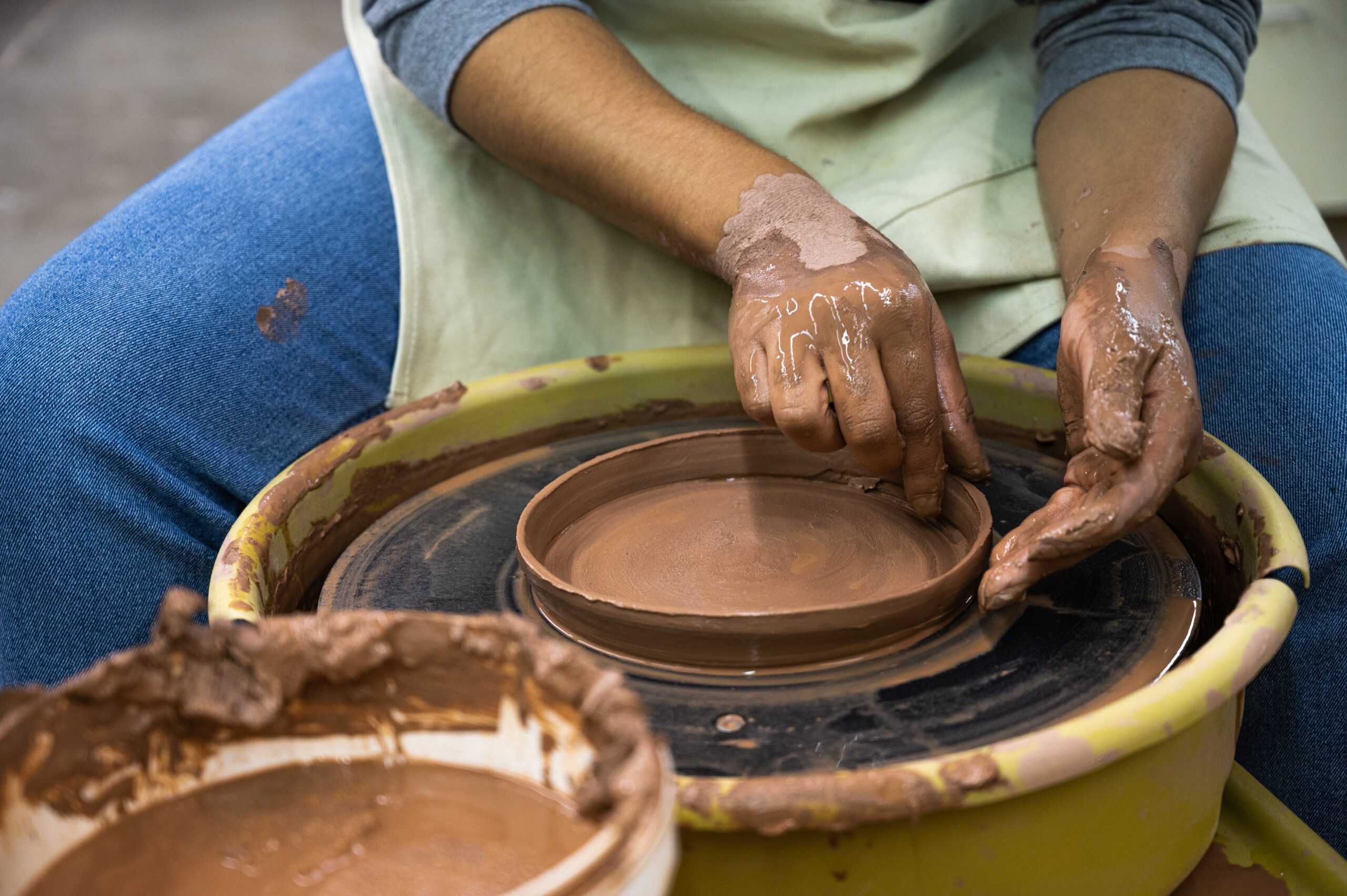 Ceramics student working in the Krasl studio